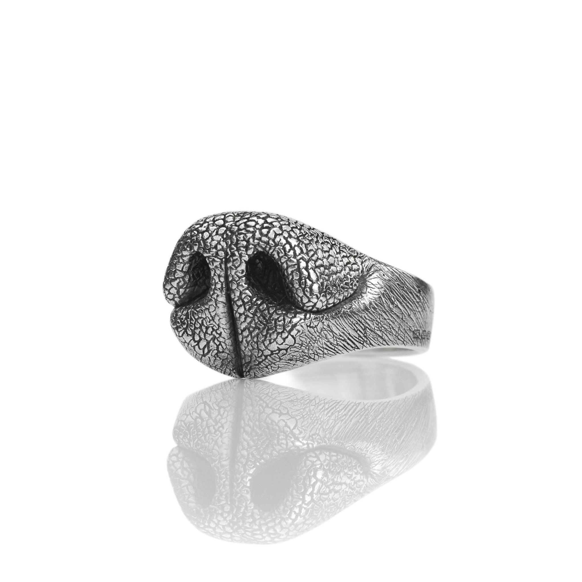 silver ring in the shape of a dog's nose